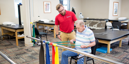 Older man undergoing physical therapy with a personal therapist at Dynamic Physical Therapy & Sports Medicine.